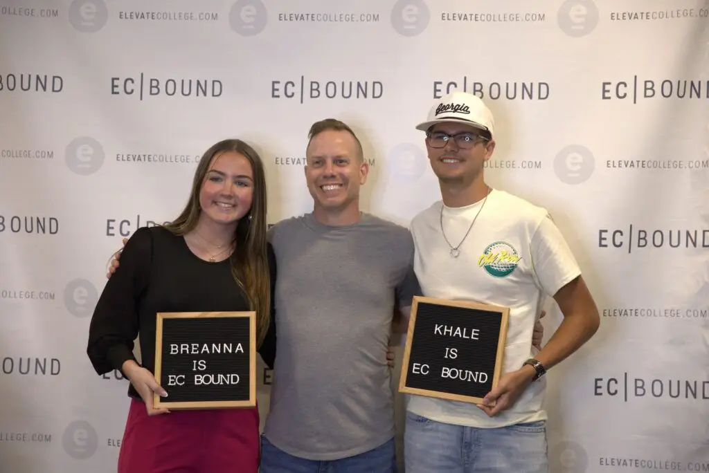 New Elevate College students holding EC Bound acceptance signs