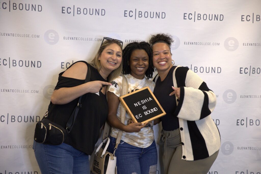 Three Elevate College students celebrating with an EC Bound sign at Elevate College Jacksonville FL